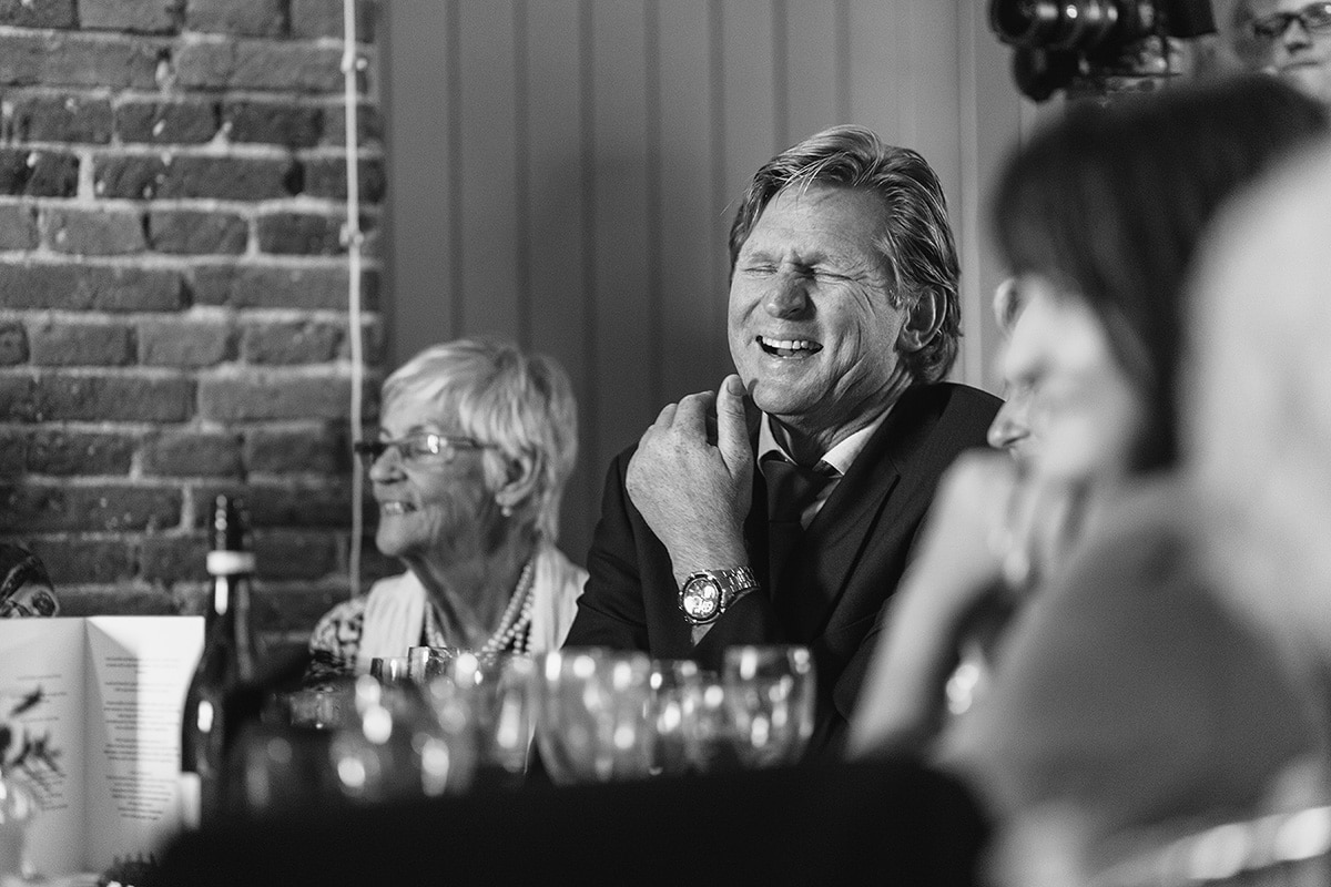 a guest laughs during the speeches