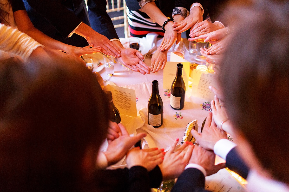 guests making a heart shape with their hands