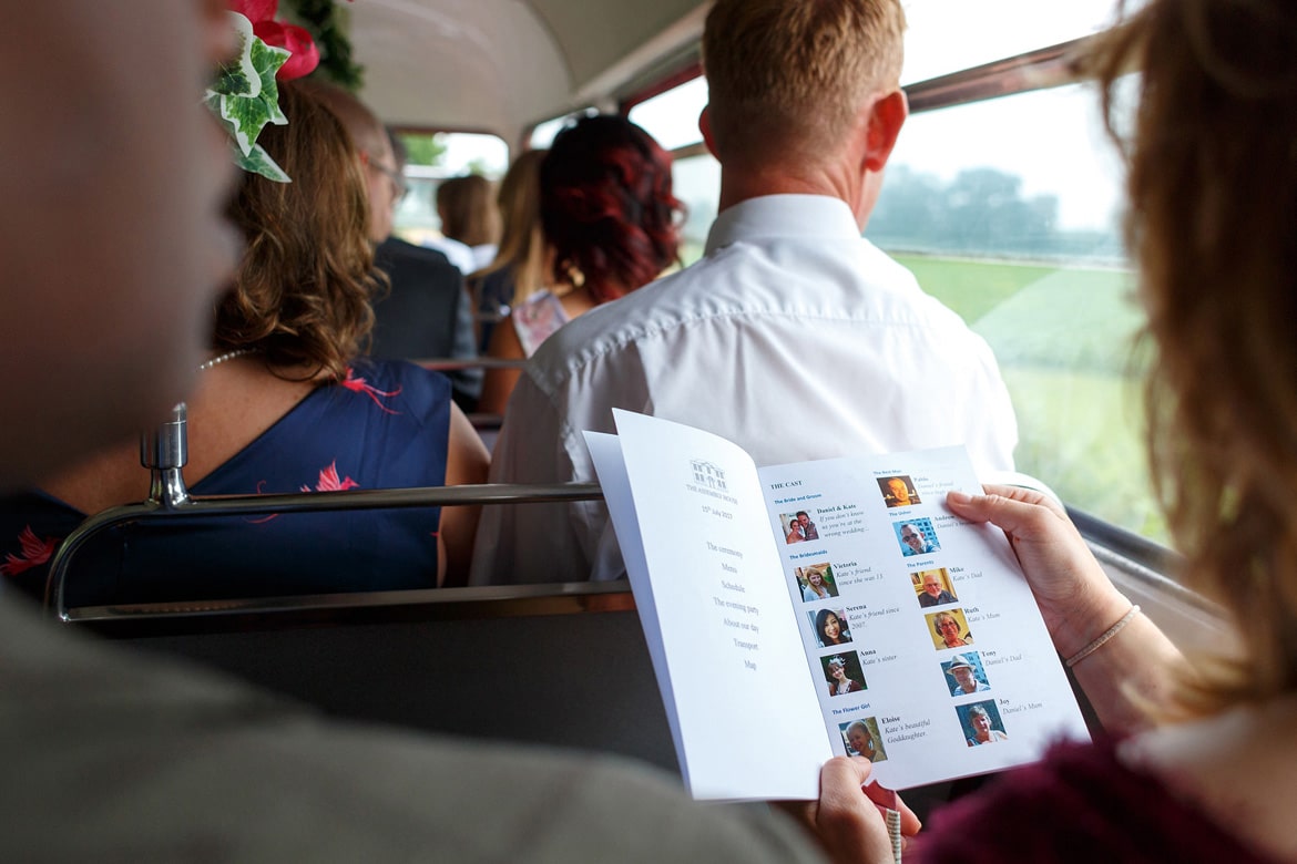 wedding guests look at the order of the day