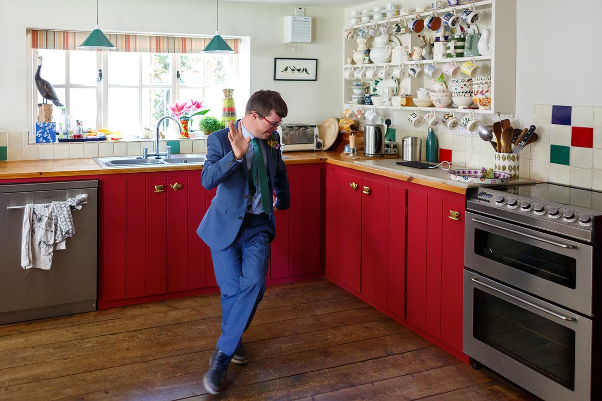 the brides brother dance in the kitchen