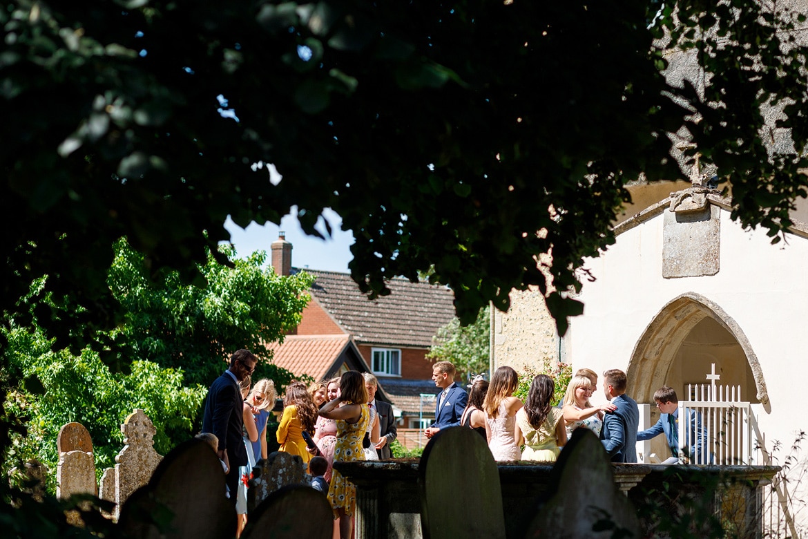 guests arrive at old buckenham church