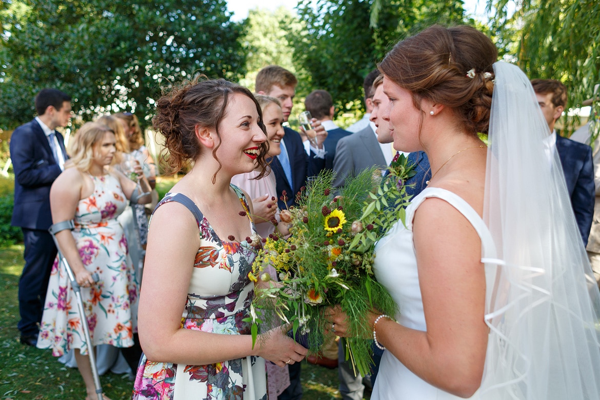 bride and groom chat to their guests