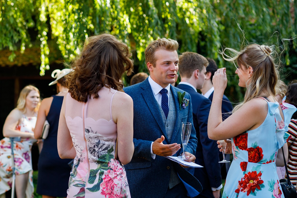 wedding guests talking in the garden