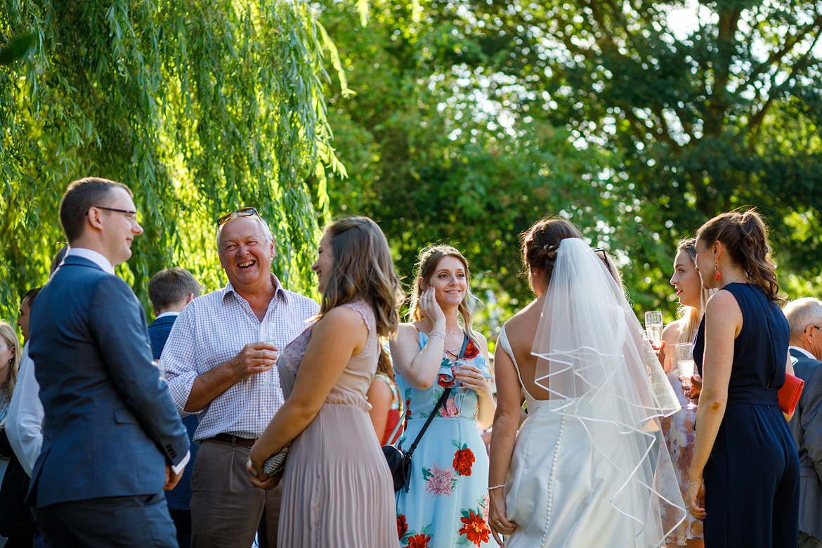 wedding guests talking in the garden