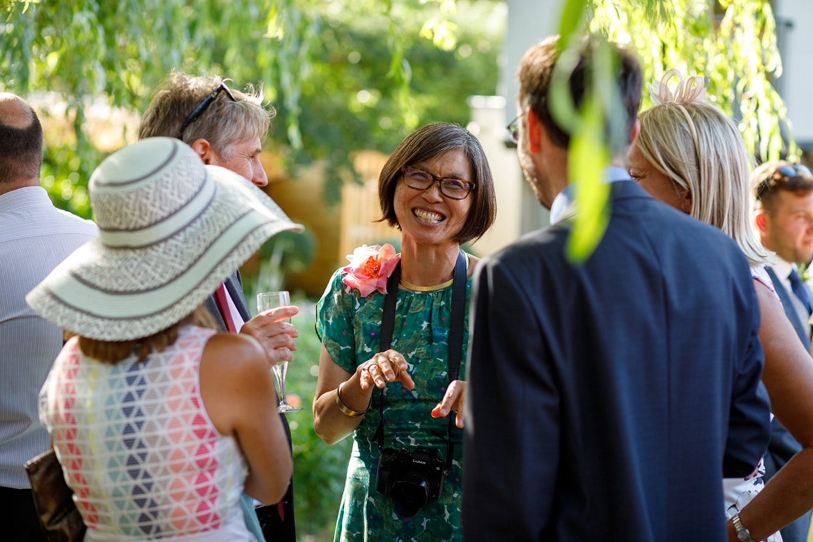 wedding guests talking in the garden