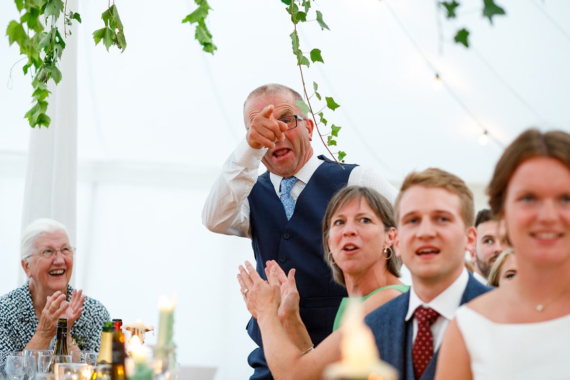 the father of the groom reacts to the father of the brides speech