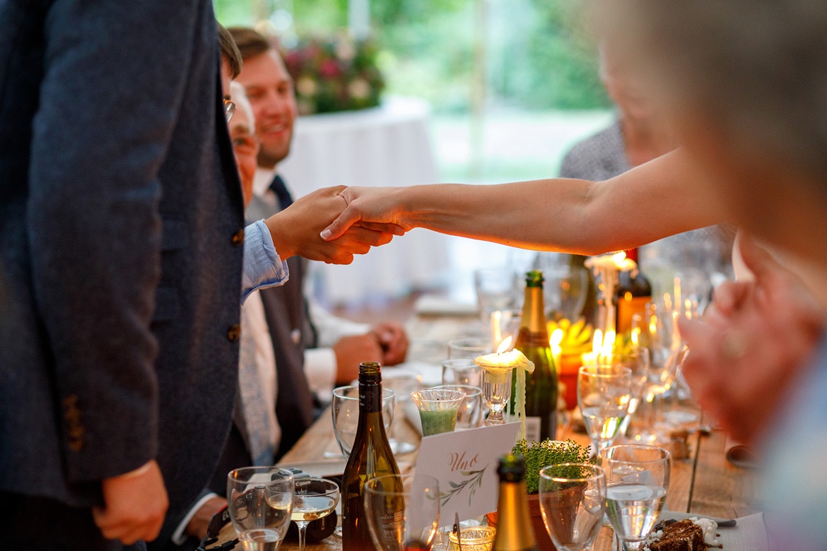 the bride and her brother shake hands