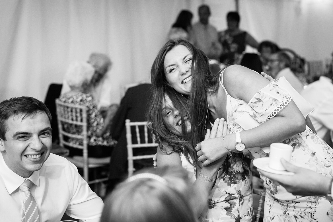 wedding guests mess with their hair