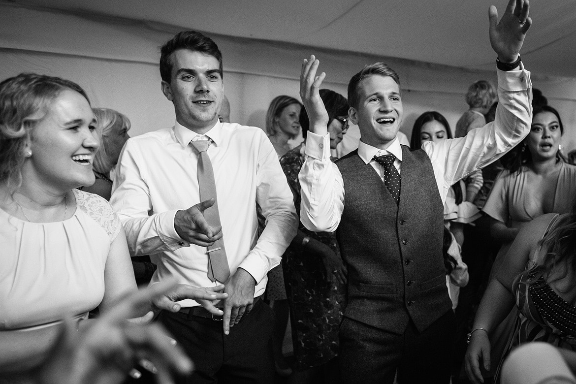 the groom dancing with the guests