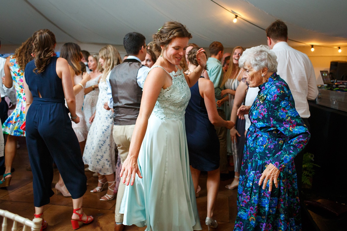 the brides sister dancing with her grandmother