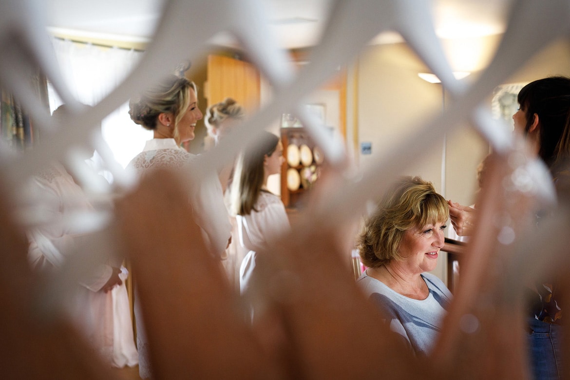 mother of the bride seen through the bridesmaids dresses