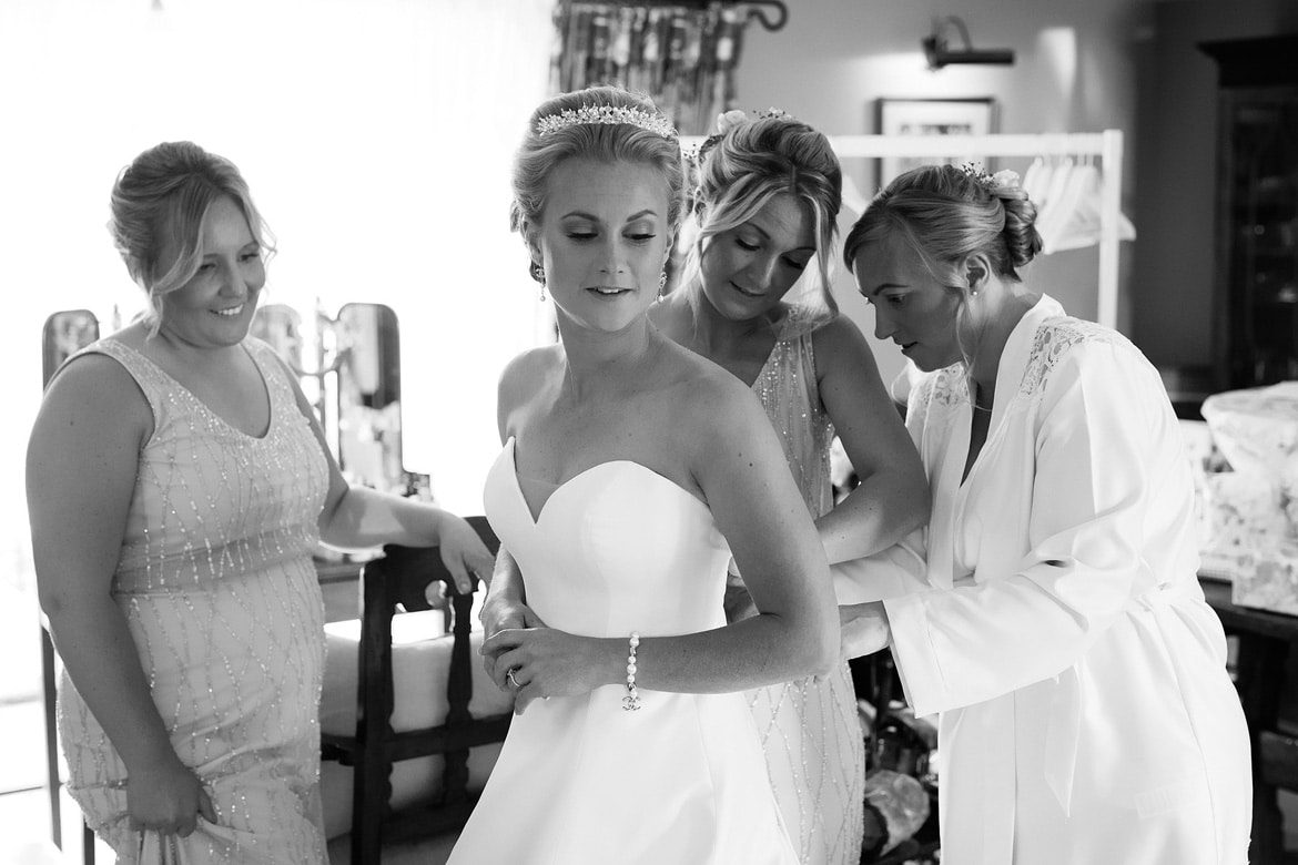 the bride gets into her dress