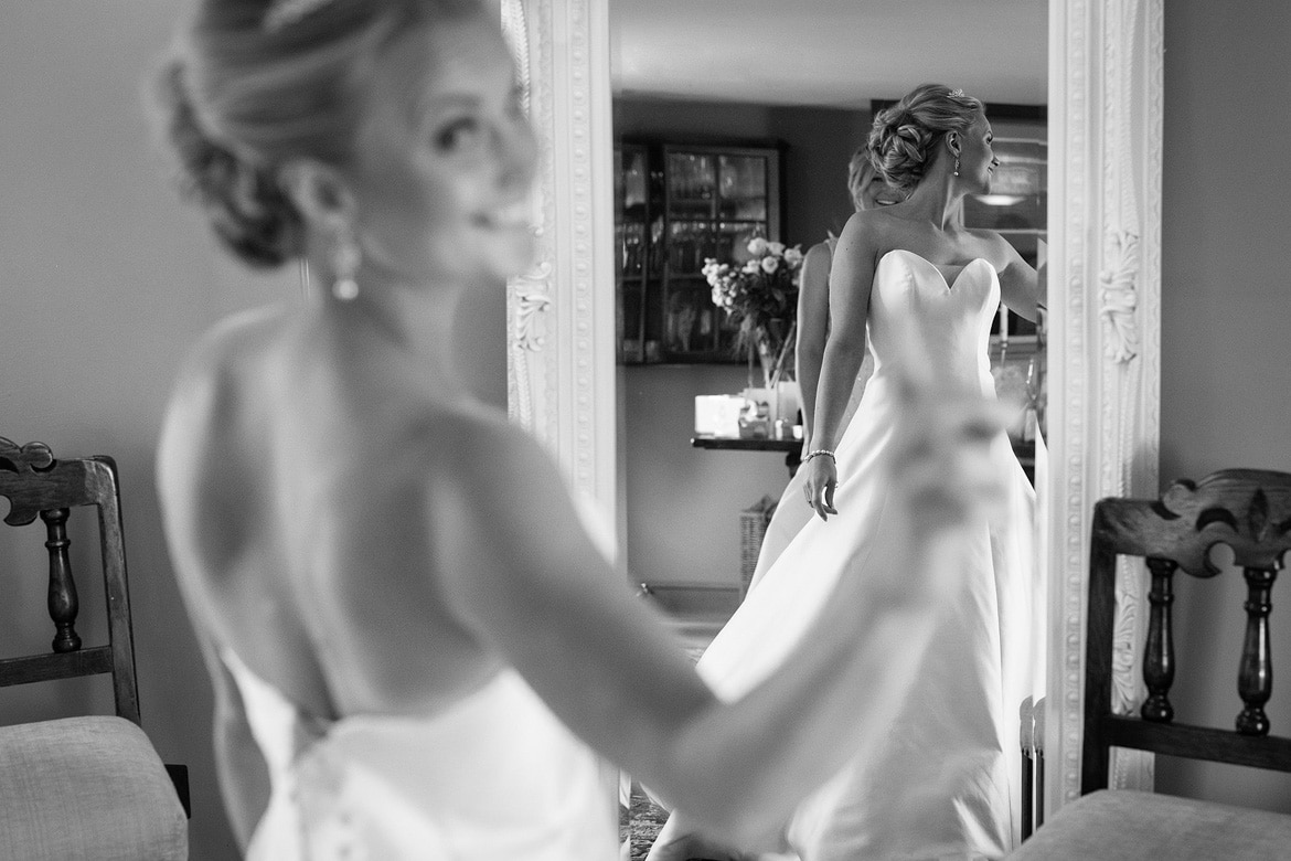 the brides reflection in a mirror