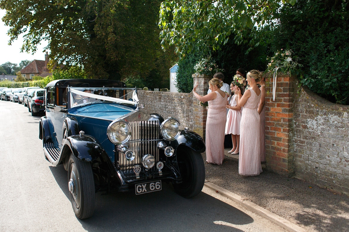 the bride arrives and is welcomed by the bridesmaids