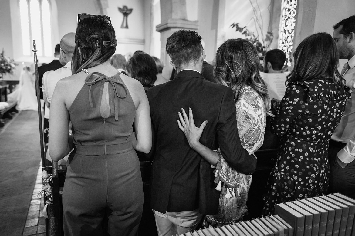 guests hug during the wedding ceremony