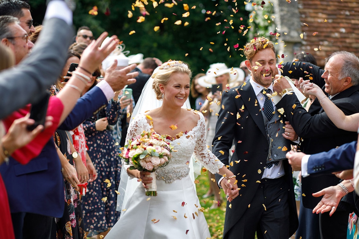 the groom gets confetti stuffed inside his uit