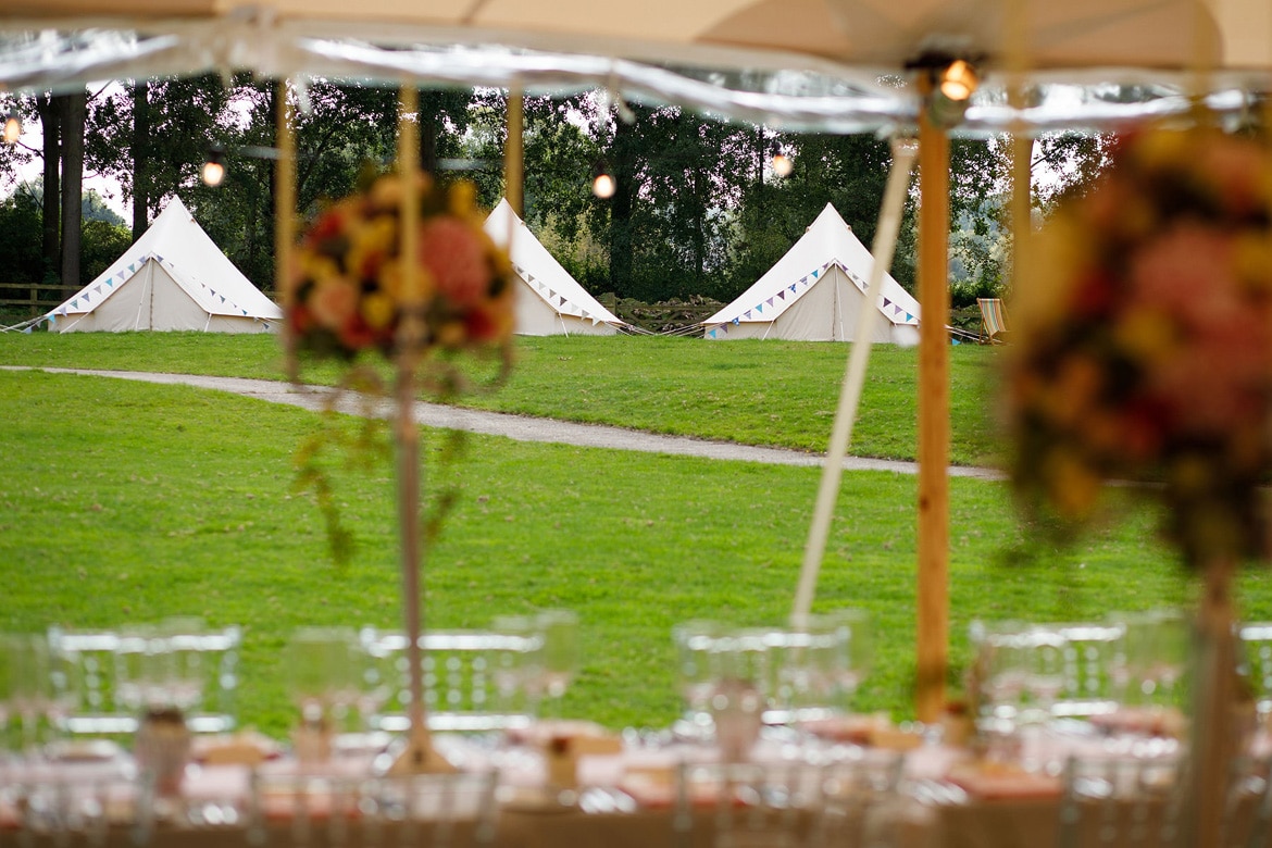 looking out at the bell tents outside