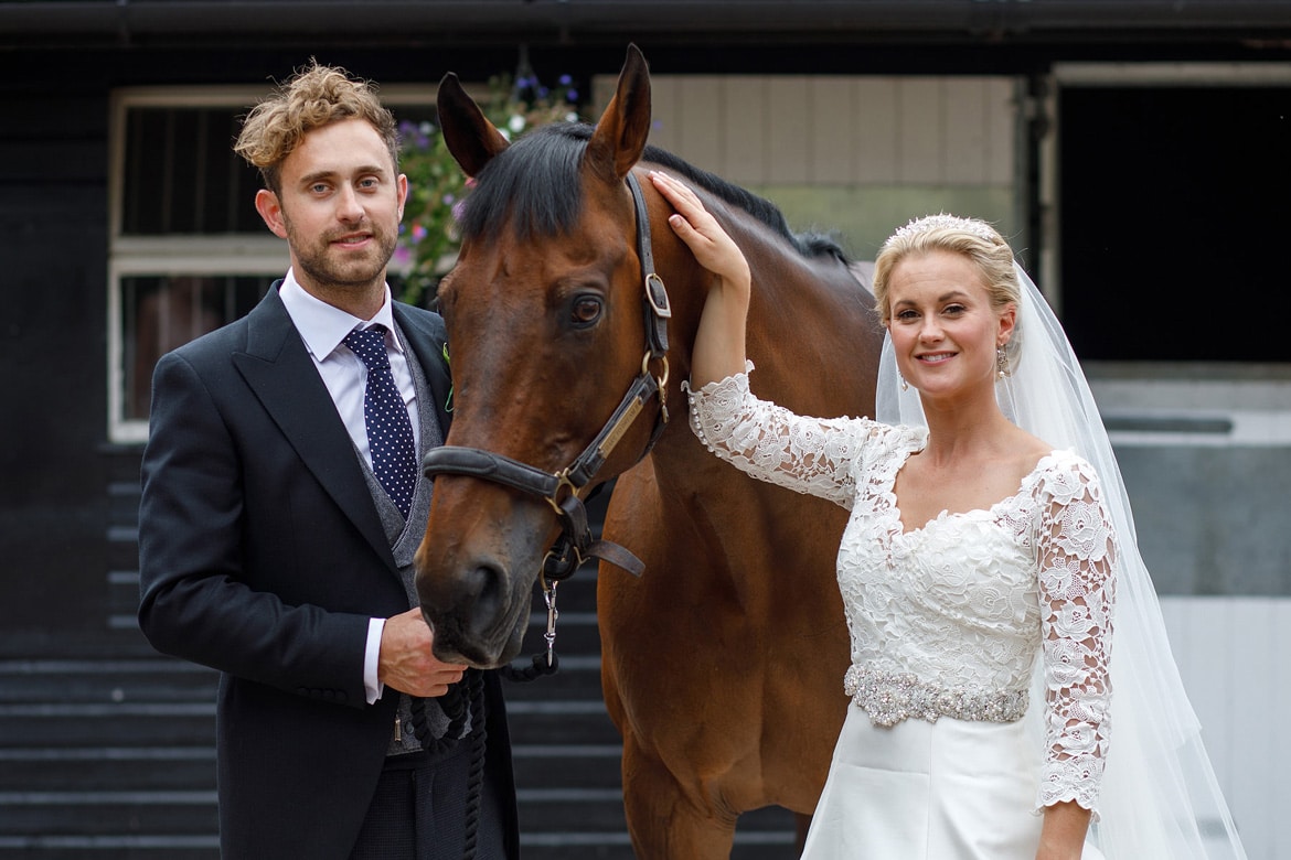 bride and groom with the horse