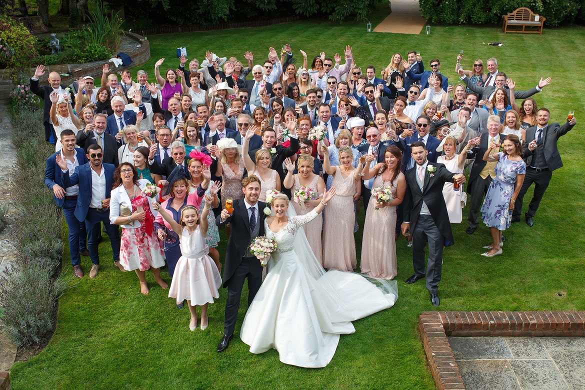 a group photo of everyone at the wedding