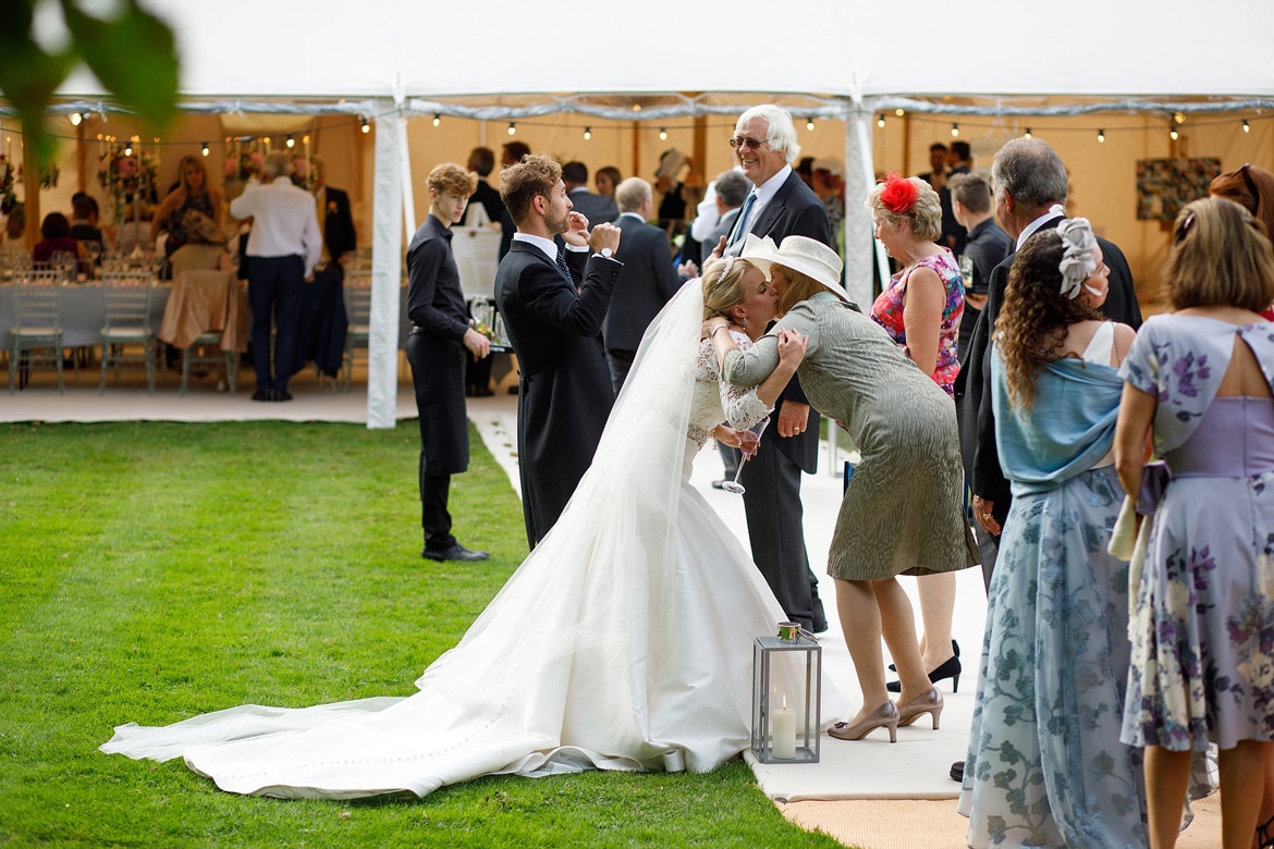 the receiving line at a summer marquee wedding