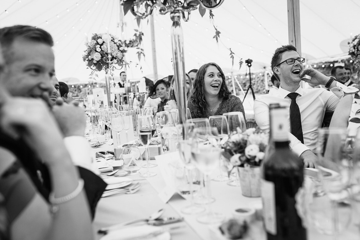 guests laughing during the speeches