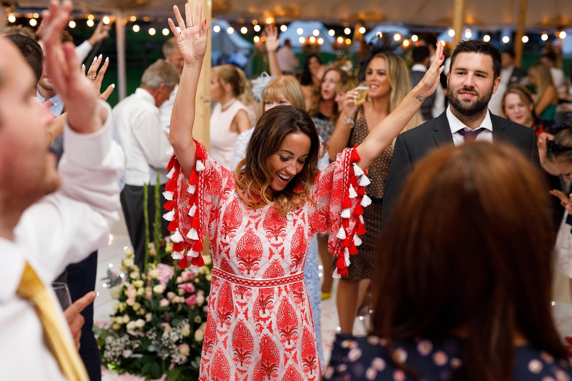 guests dancing at a summer marquee wedding