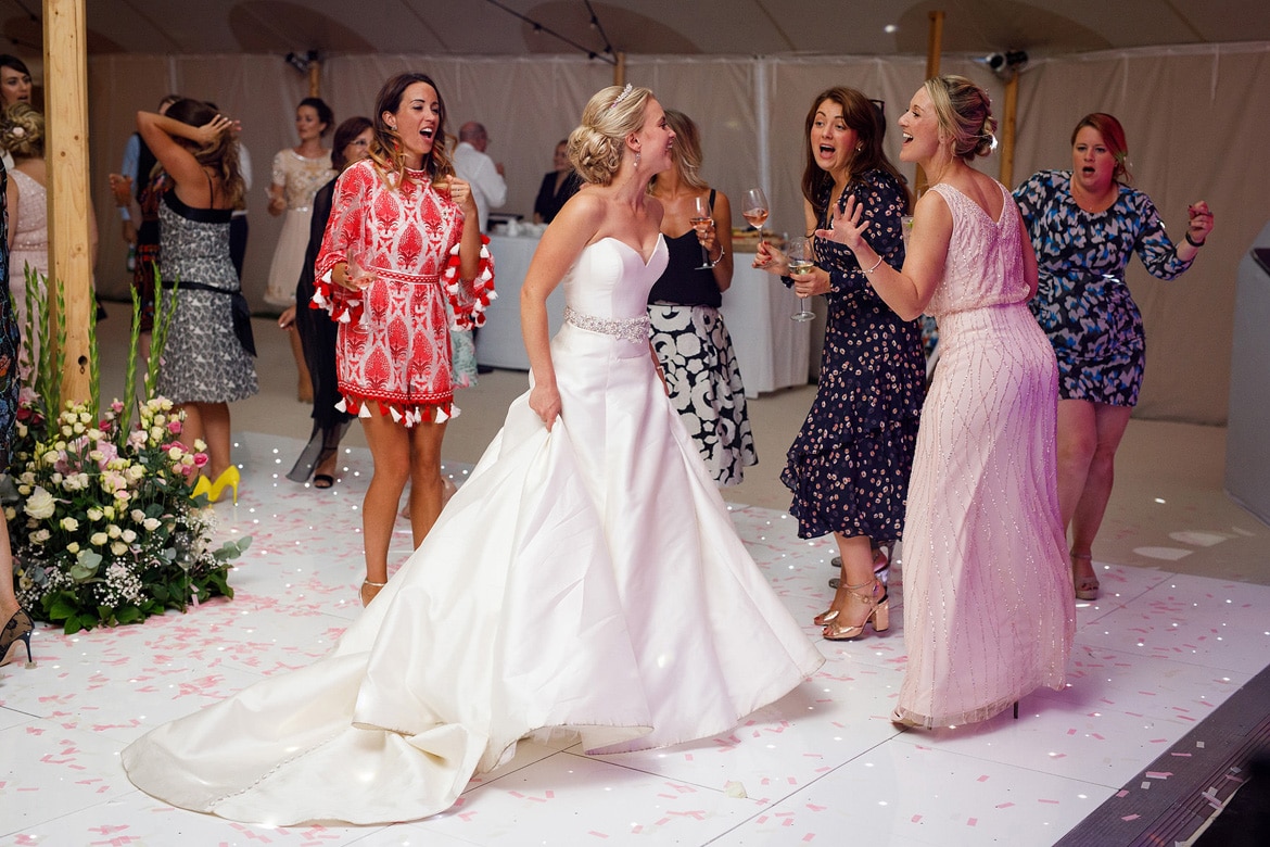 bride with bridesmaids on the dancefloor