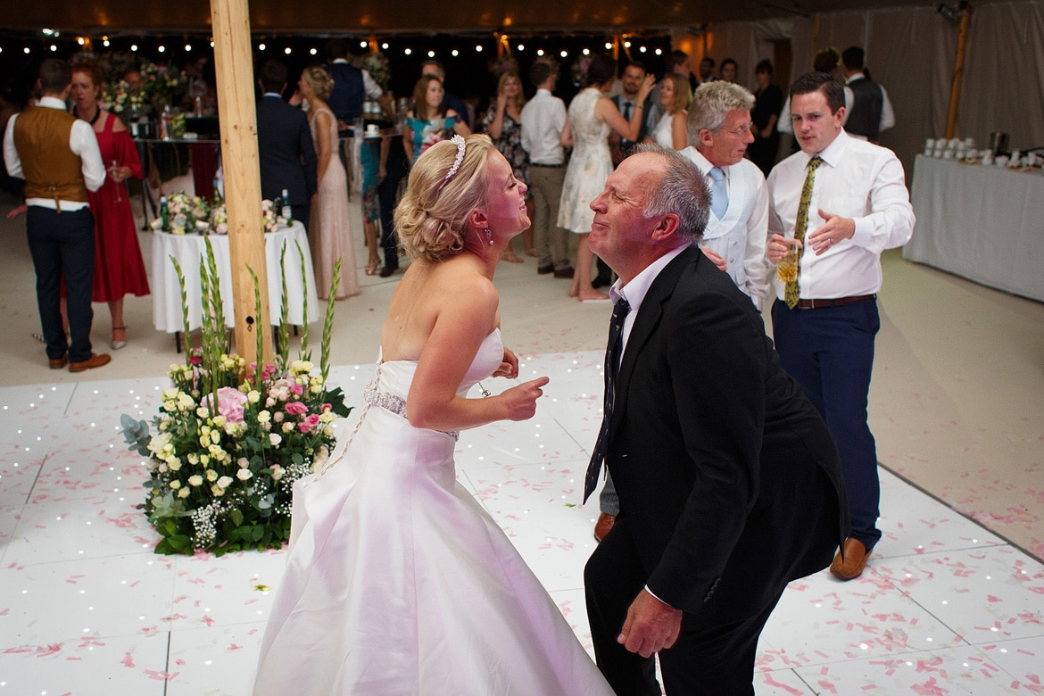 the bride dances with a guest