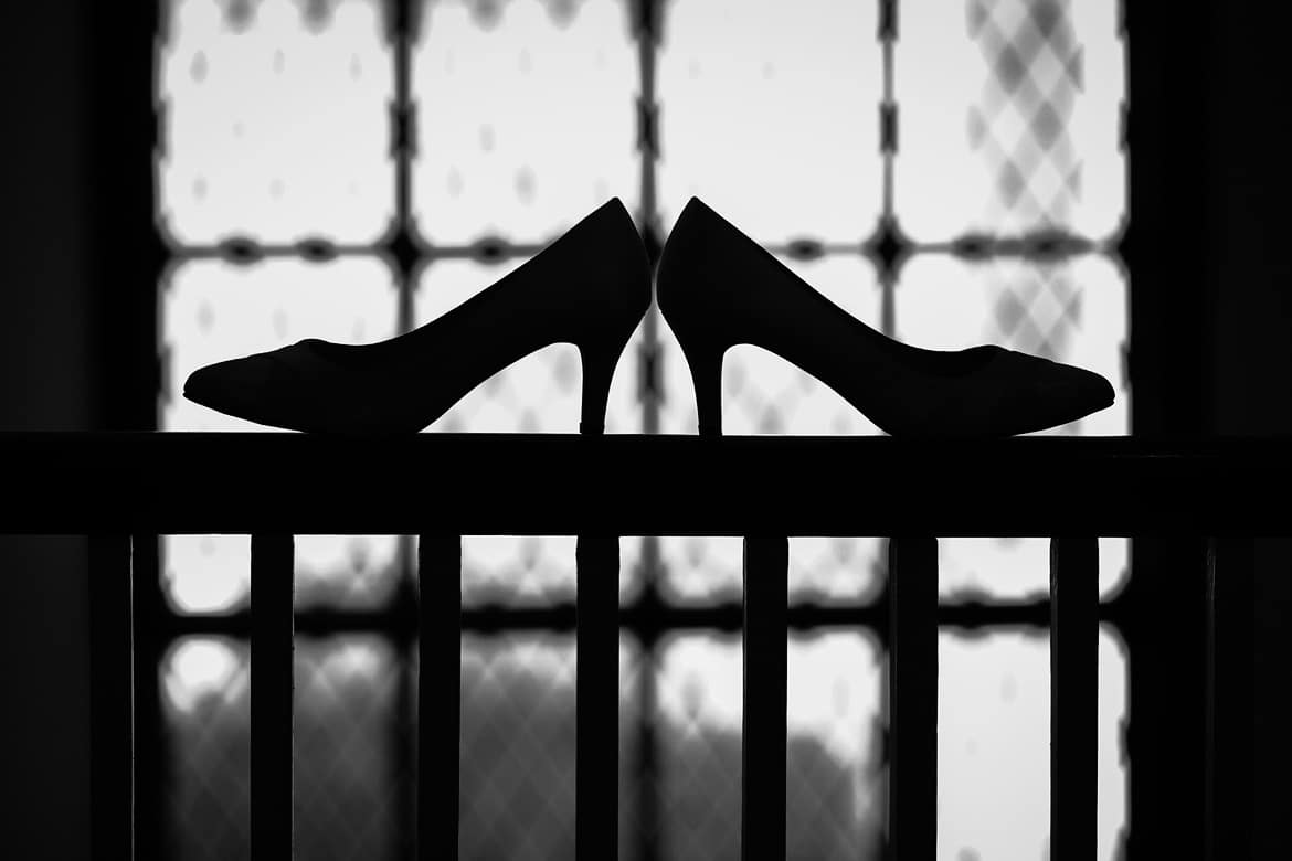 wedding shoes against a pennard house window