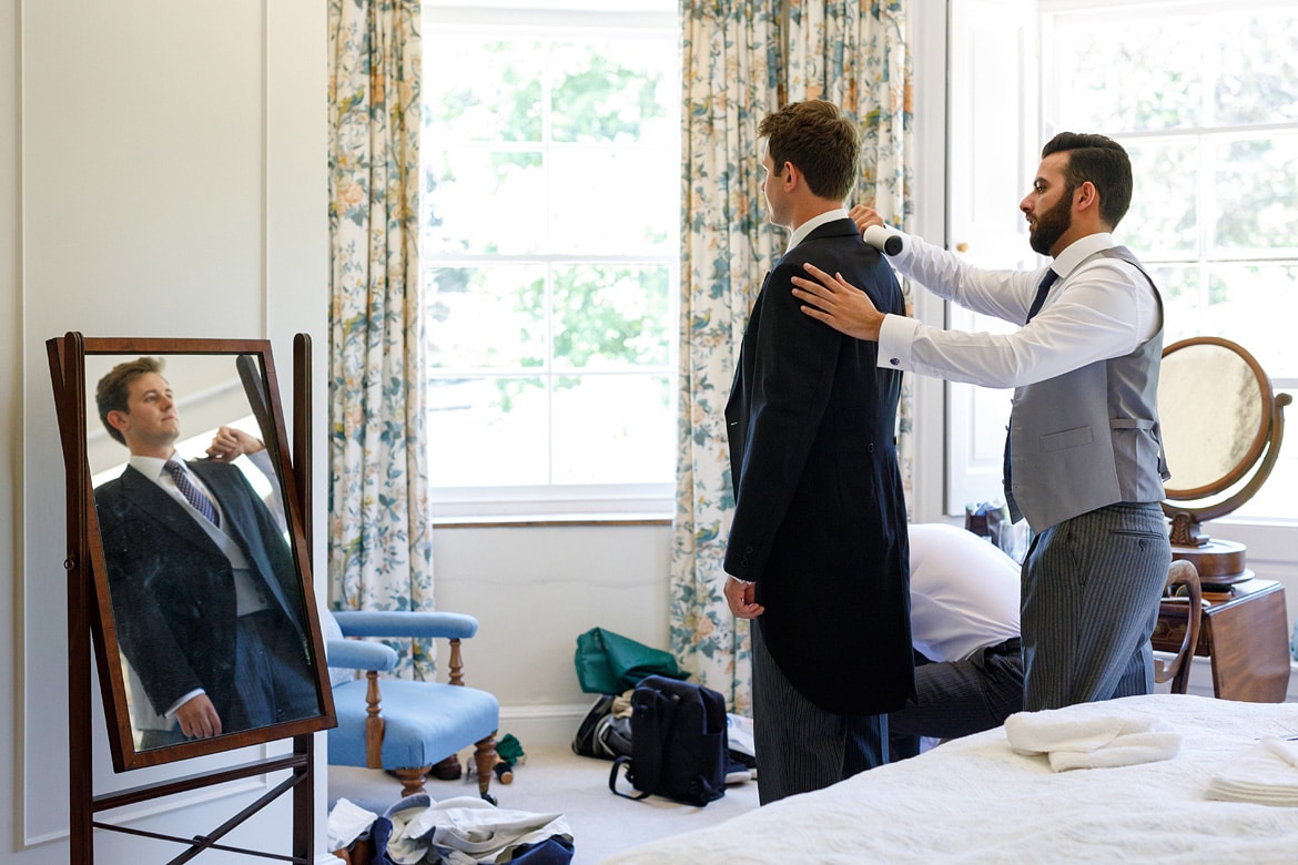 final touches for the groom by the bestman