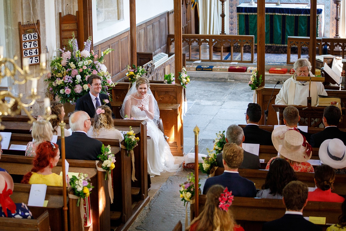 the bride laughs with her wedding guests