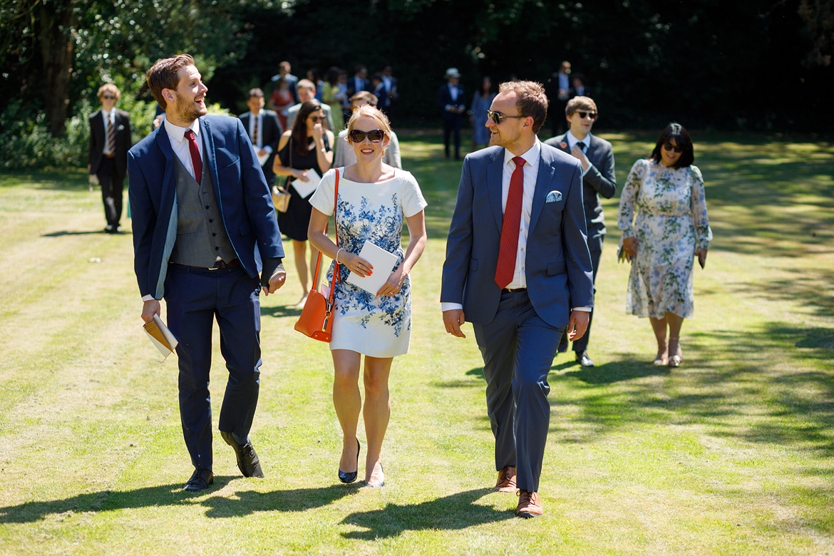 wedding guests walking up the lawn at pennard house