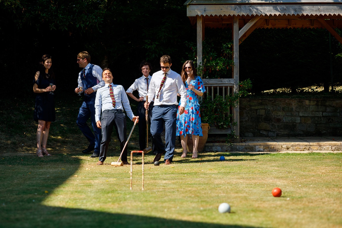 guests playing croquet