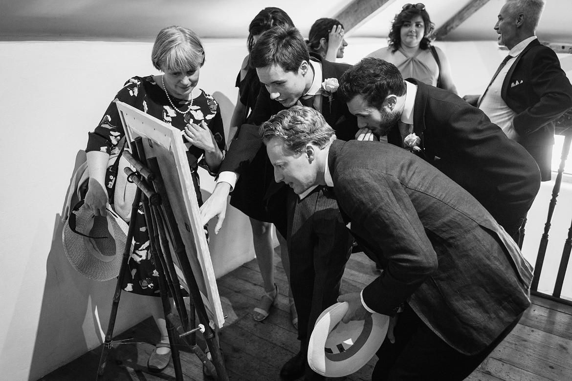 wedding guests look at the seating plan