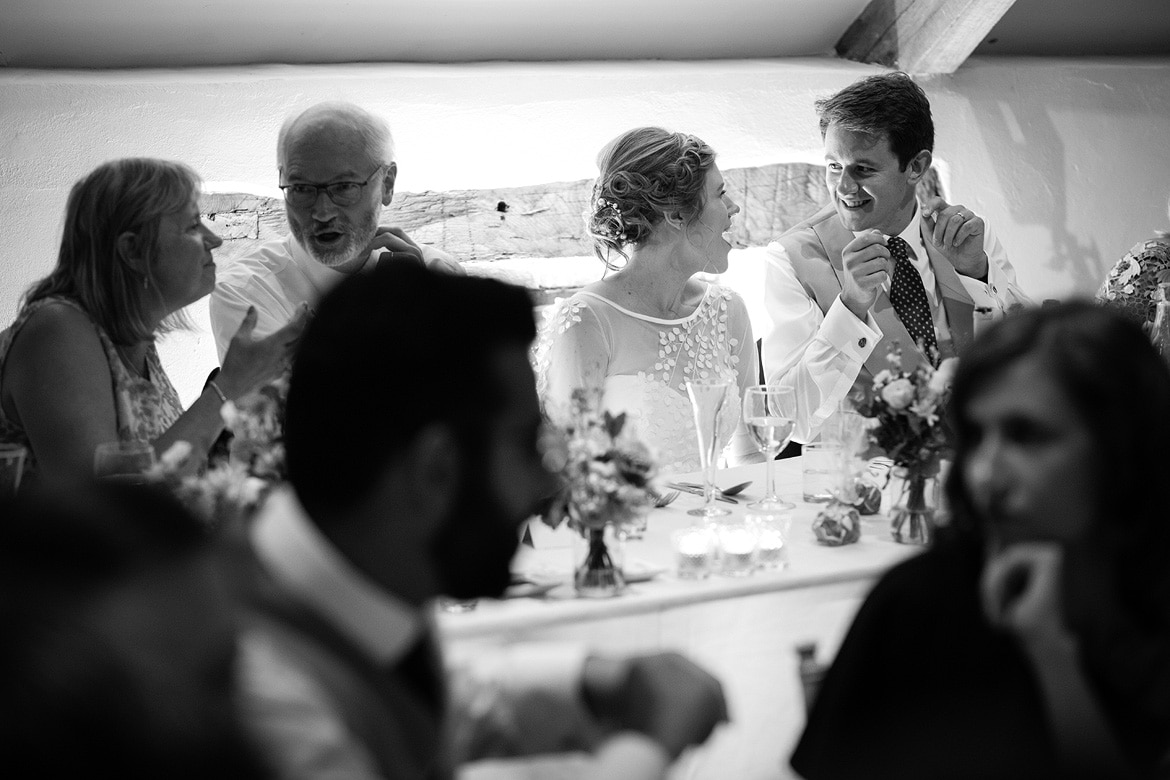 bride and groom share a joke