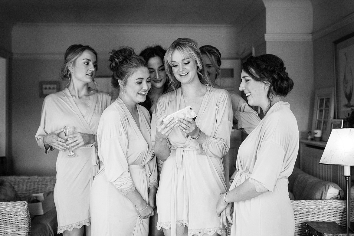 bridesmaids look at a selfie