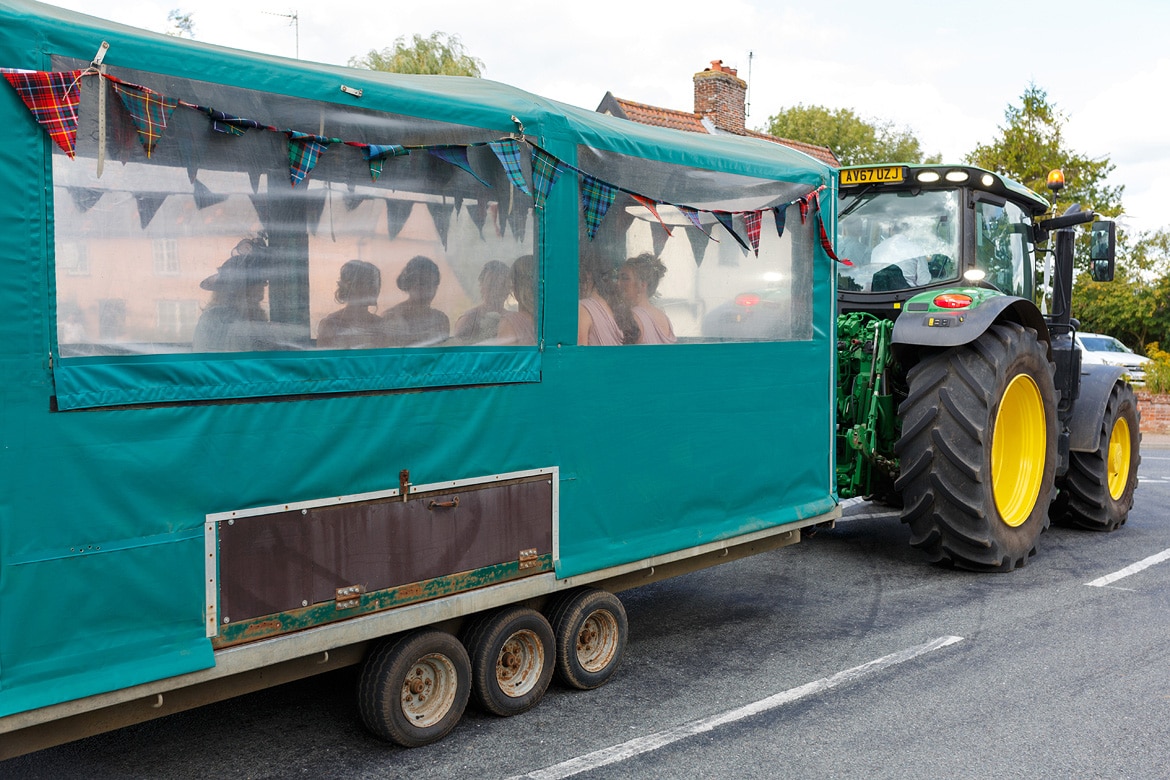 the bridesmaids arrive in a gun cart