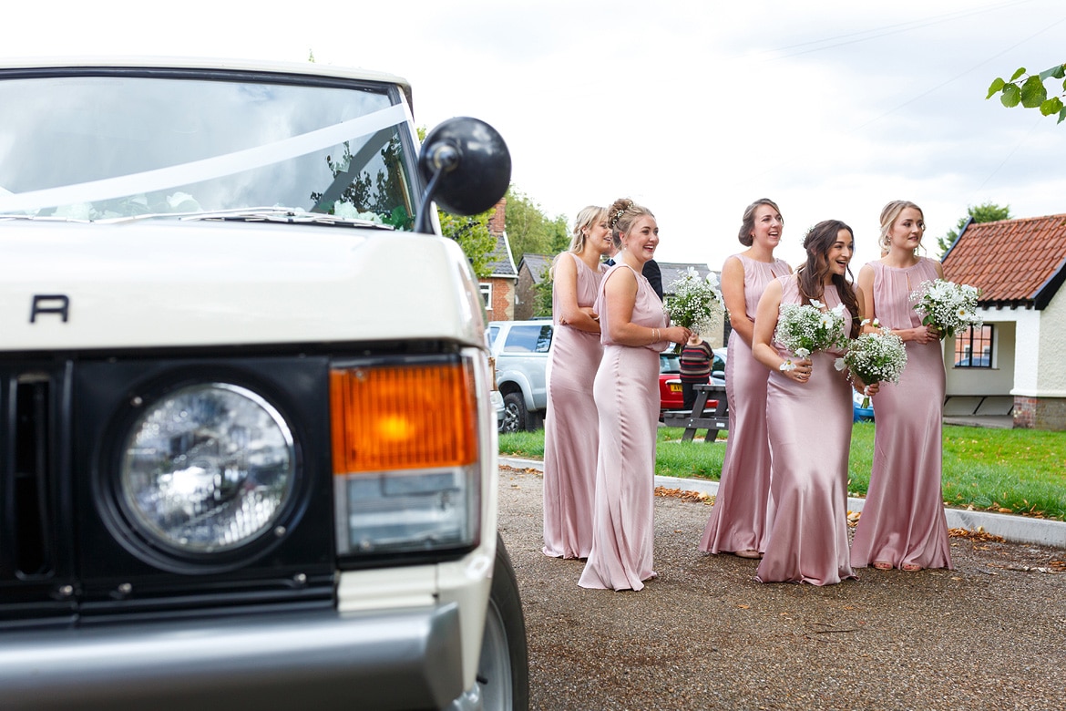 bridesmaids wait with the bride