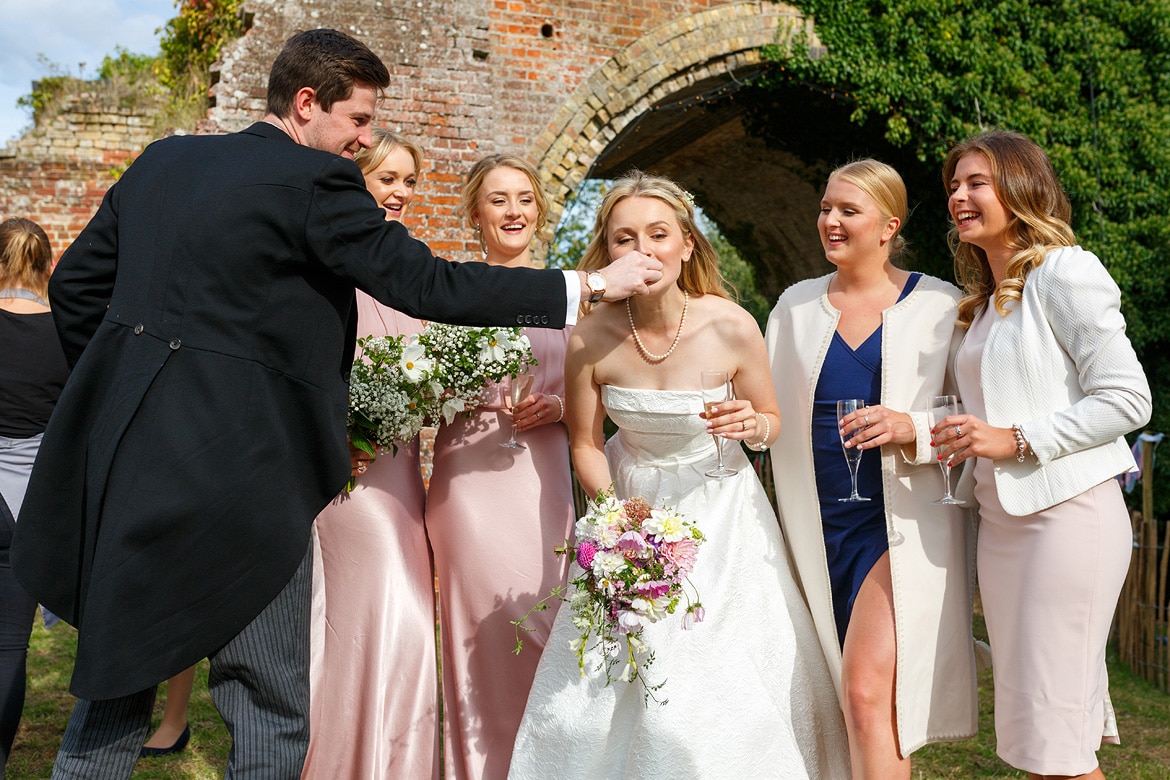 helping the bride take a bite