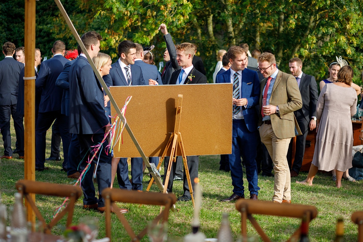 wedding guests outside the marquee