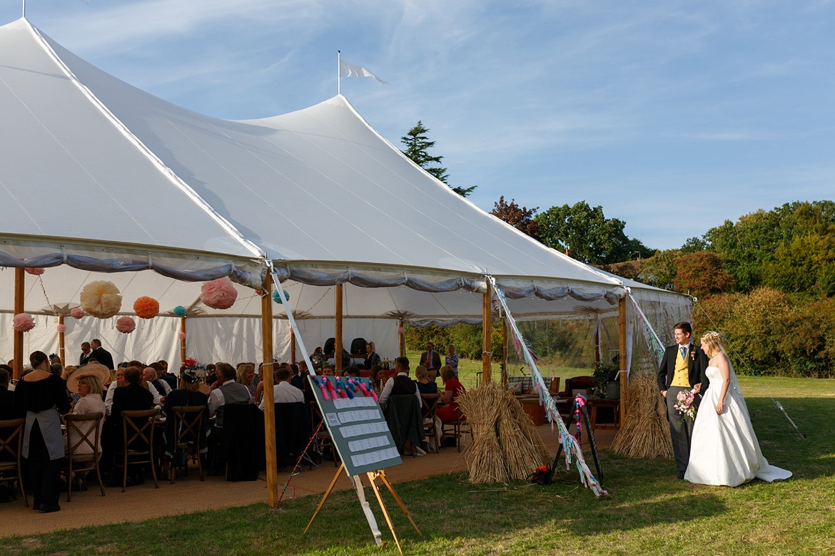 bride and groom wait to enter the marquee