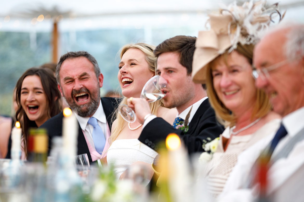 the bride laughs during the speeches