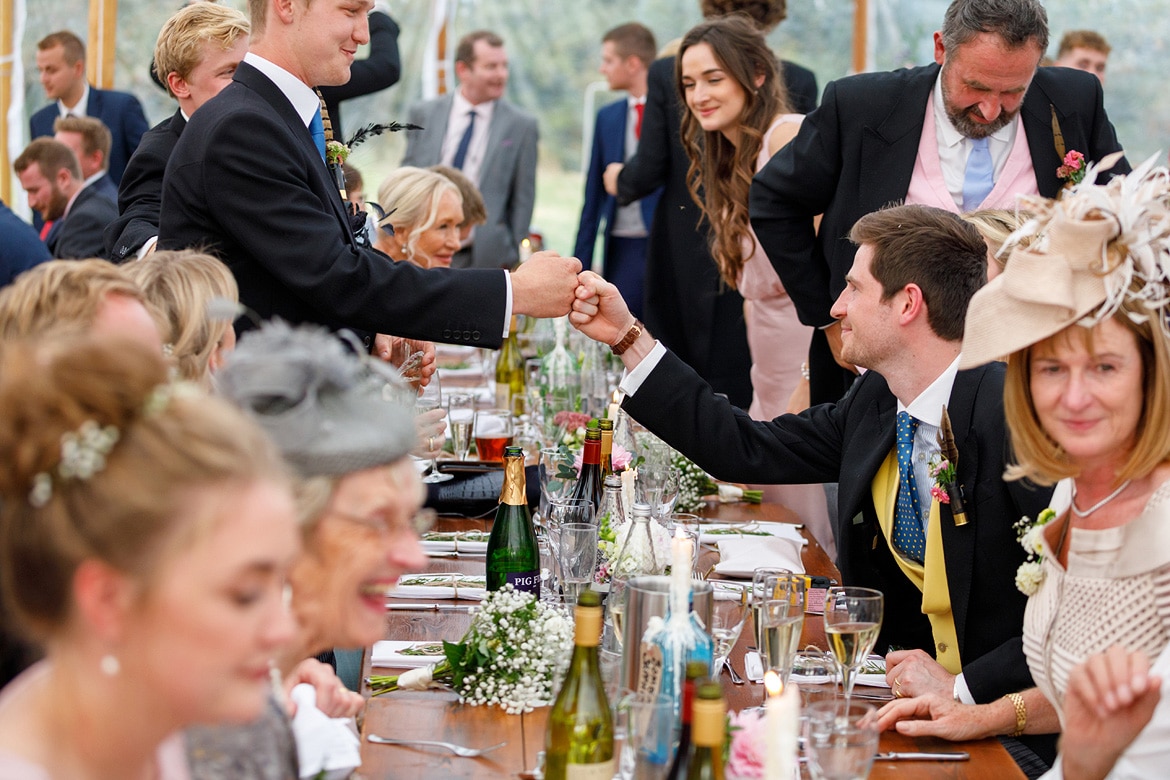 groom and best man fist bump