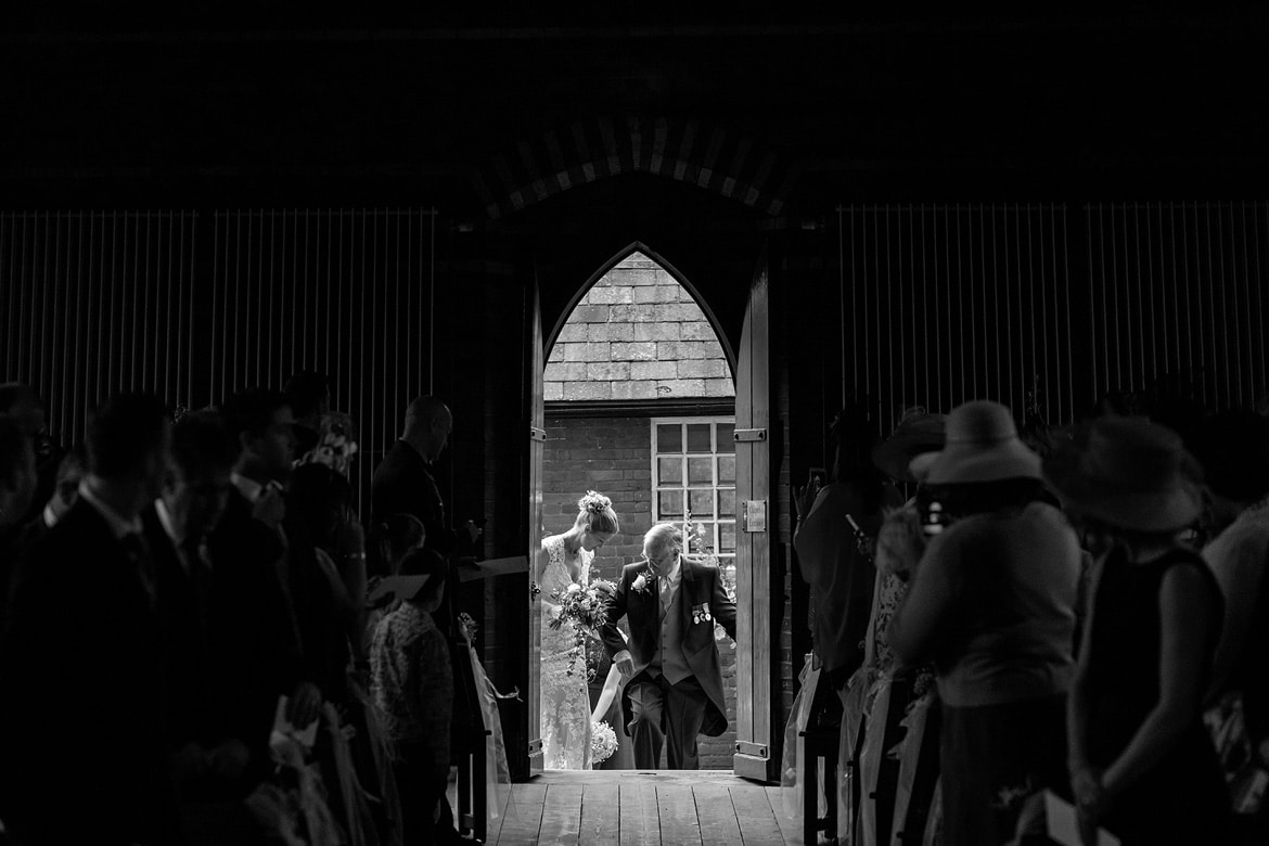 a bride her father at the door to gressenhall museum chapel