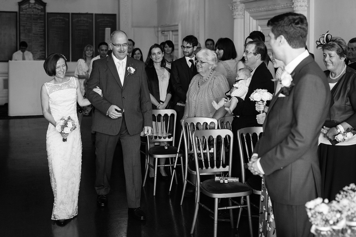 susie and her dad walk down the aisle