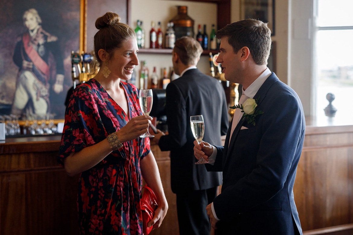 steve talks to a wedding guest