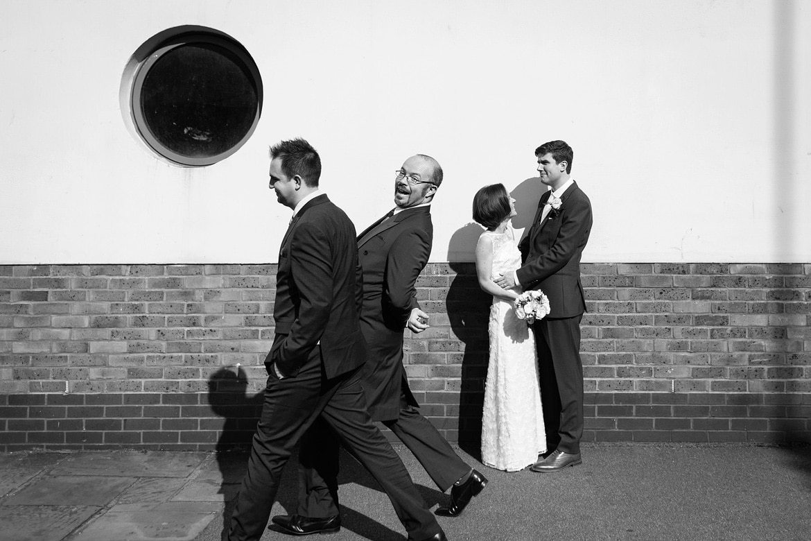 some guests photobombing the couple shots