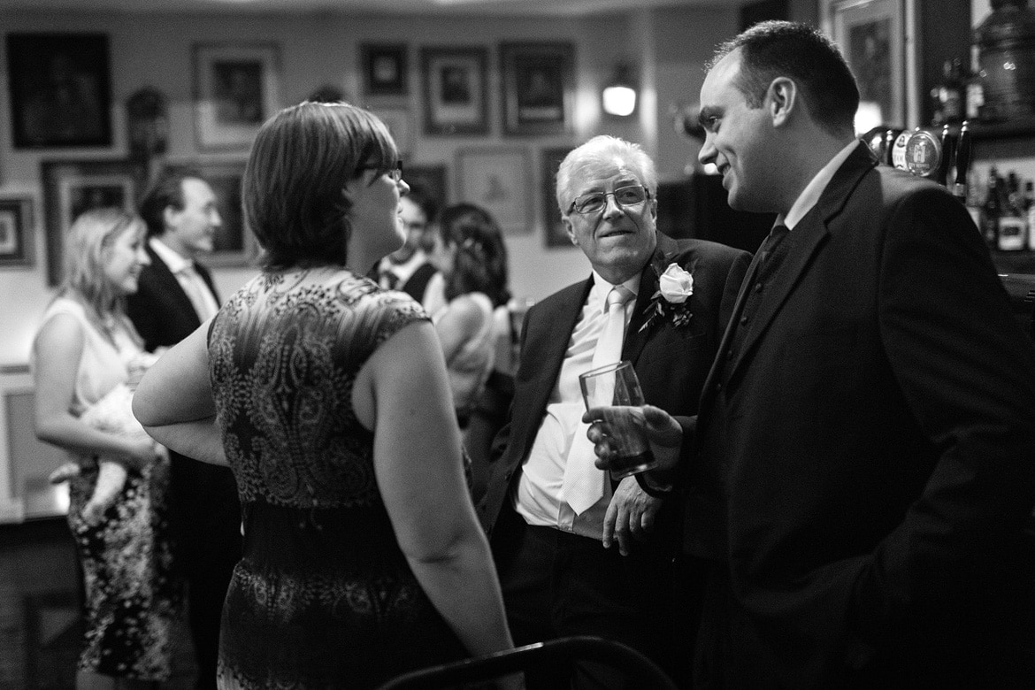 guests talking at the bar