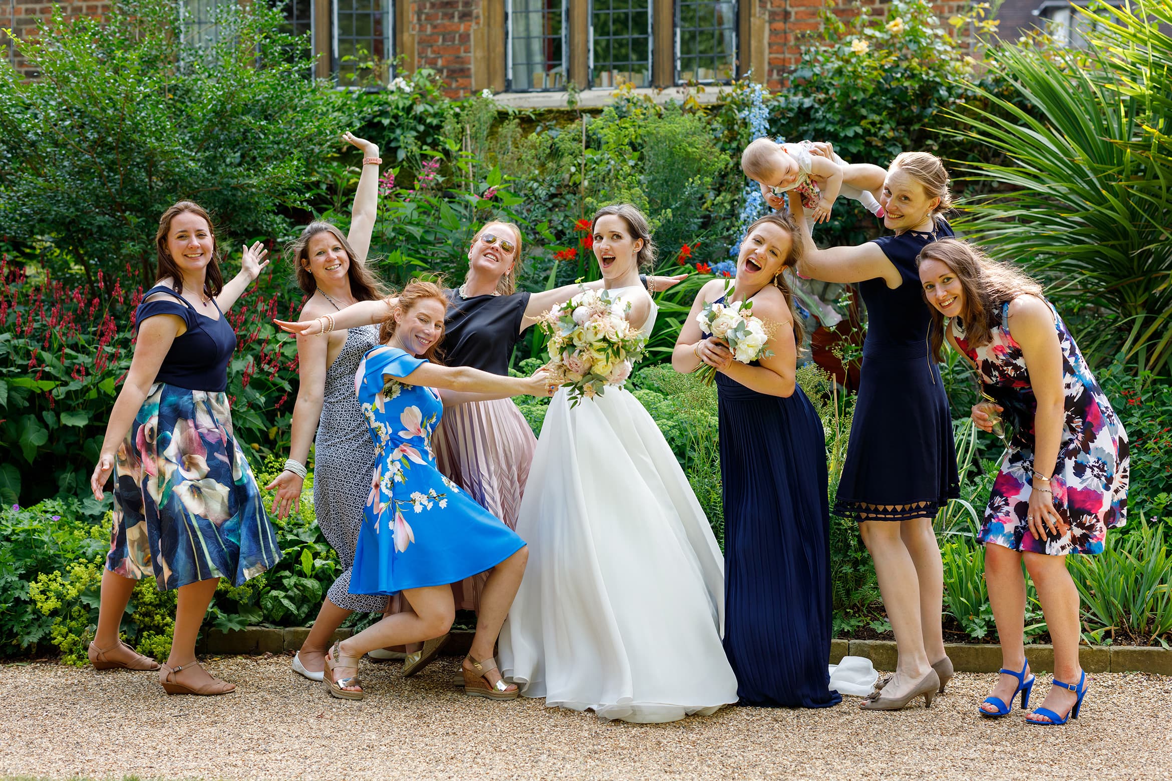 the bride and her friends pose