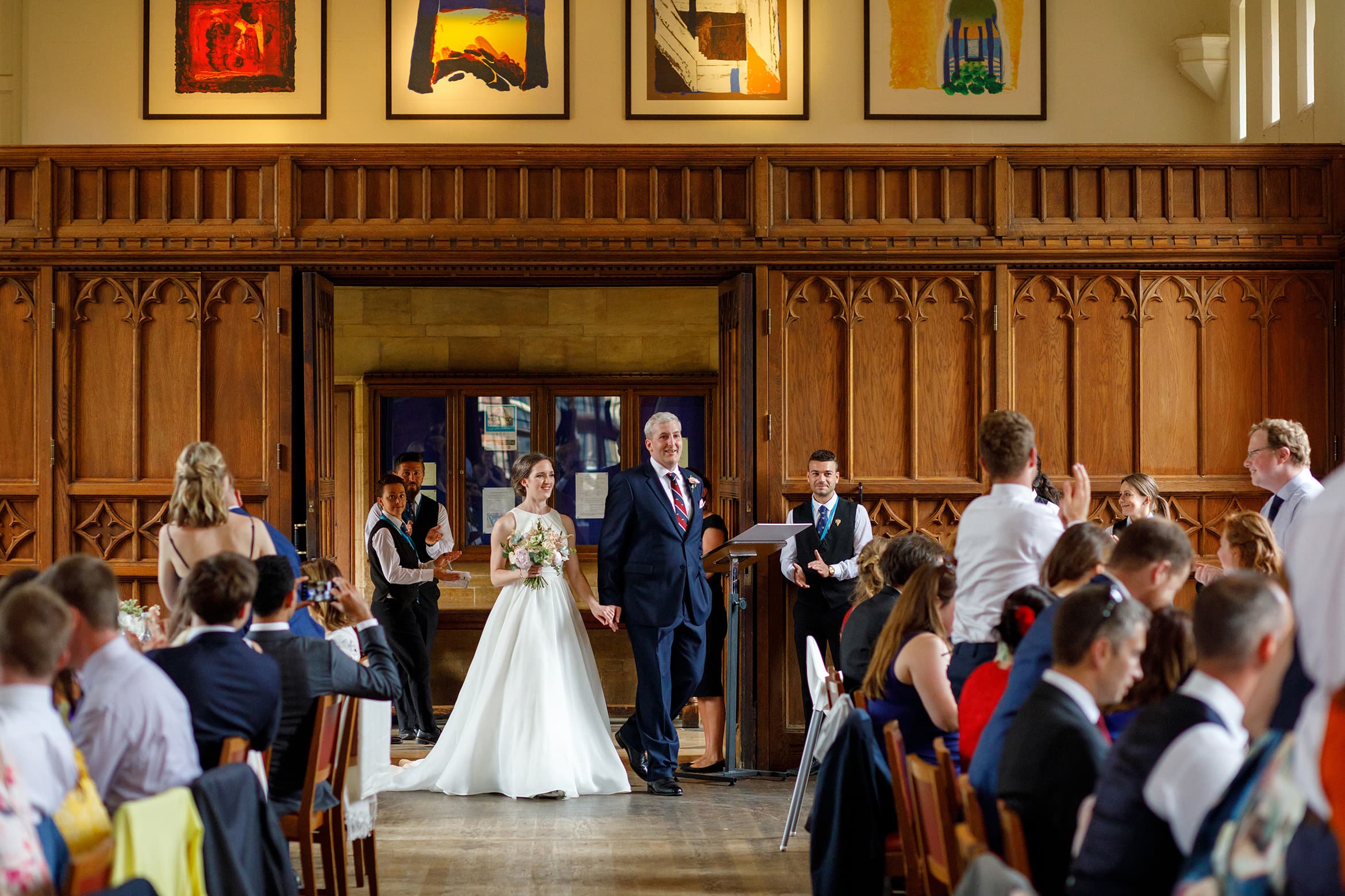 bride and groom enter the wedding breakfast